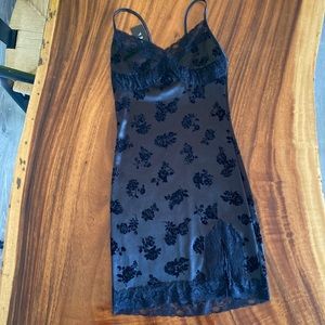 Black satin dress with velvet flowers and lace detail